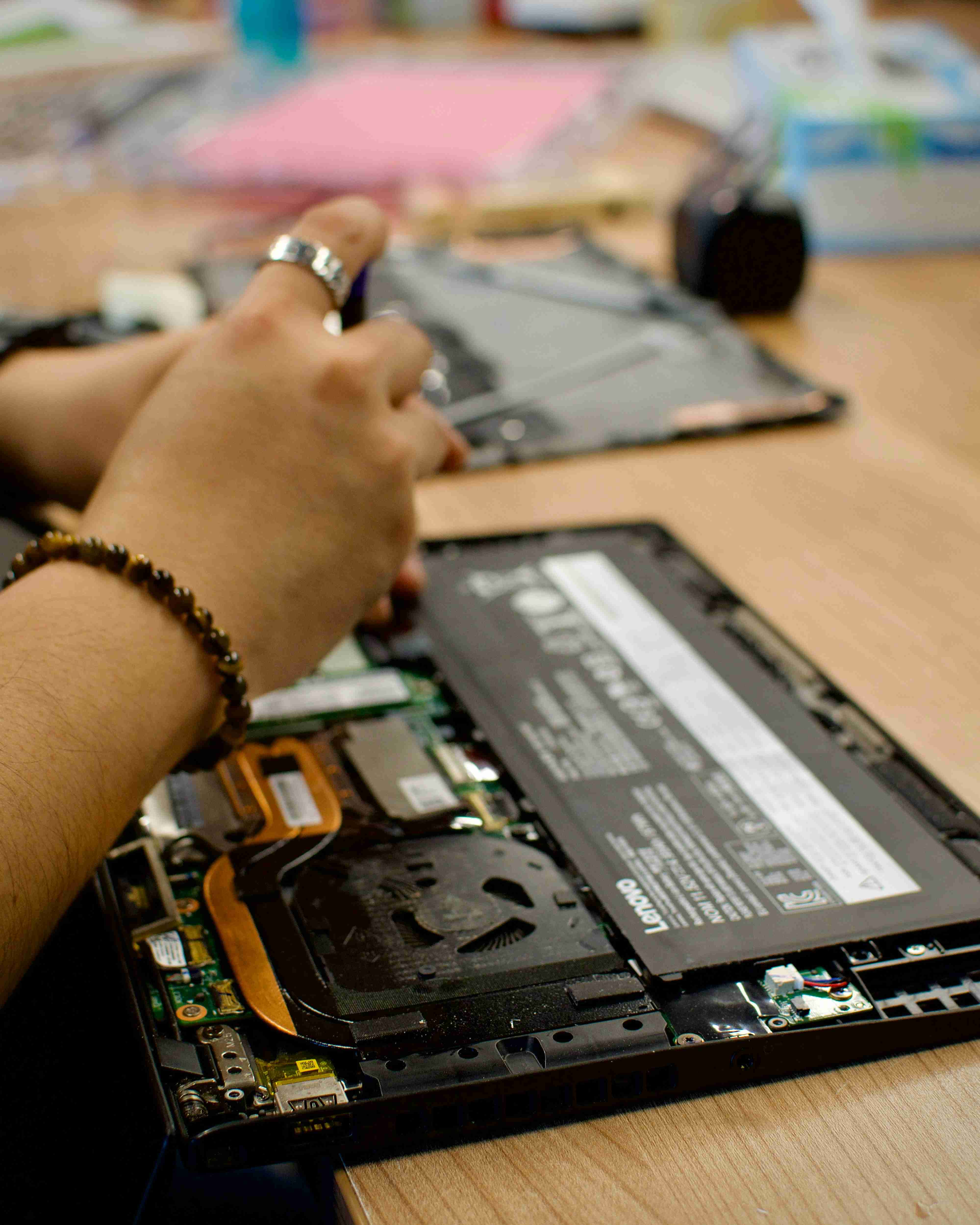 A help desk technician working on a laptop